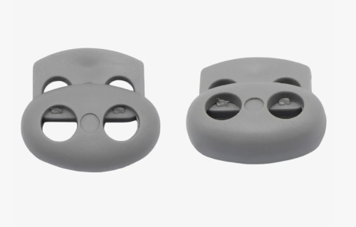  Фиксатор для шнура 2 отверстия Овал 103-М (27002-СМ) цв.Серый светлый (уп.50/250/1000 шт)  ТриКатушки