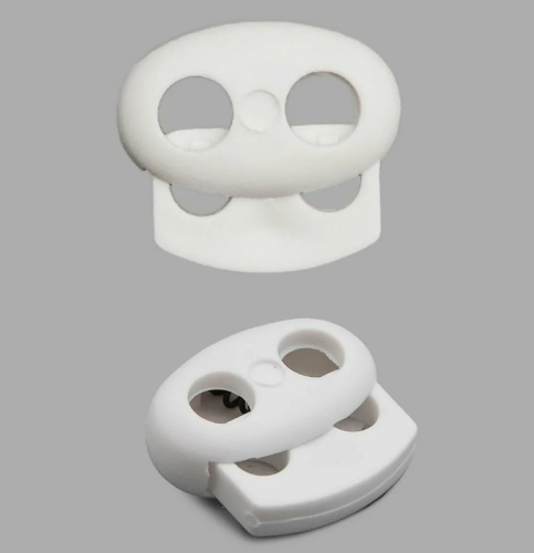  Фиксатор для шнура 2 отверстия Овал 103-М (27002-СМ) цв.Белый (уп.50/250/1000 шт)  ТриКатушки